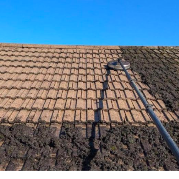 Professional Roof Cleaning Wigan service removing moss and dirt from residential roof tiles